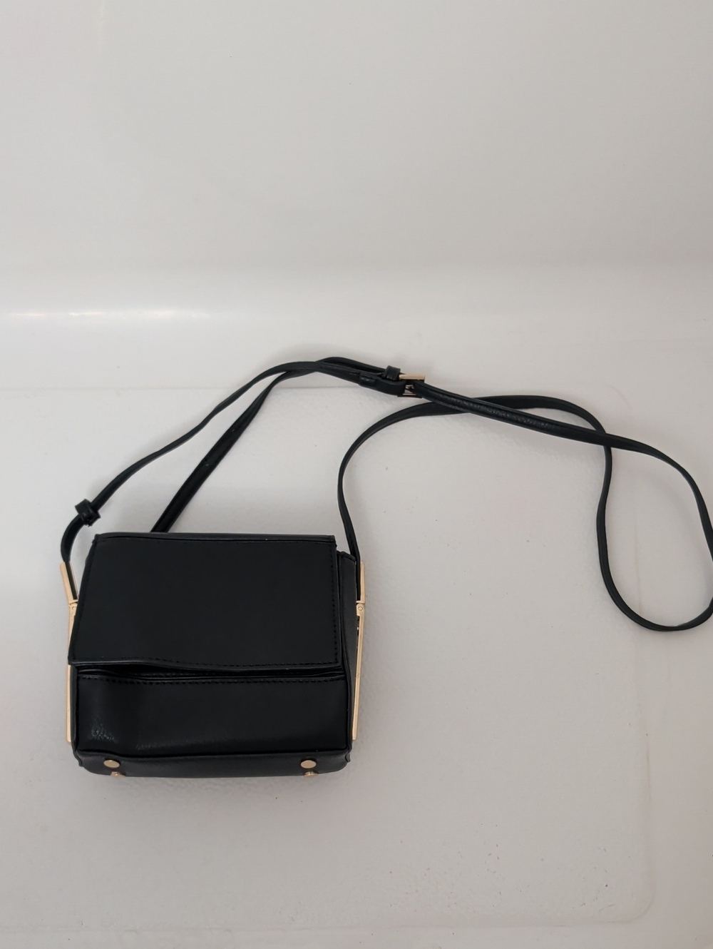 Maddison West Black Crossbody Vegan Leather Shoulder Bag with Gold Trim